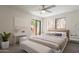 Bright main bedroom with ceiling fan and balcony access at 3031 N Civic Center Plz # 255, Scottsdale, AZ 85251