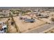 Expansive property featuring a charming white home and detached garage on a large, fenced lot at 30433 W Bellview St, Buckeye, AZ 85396