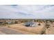 A charming single-story home in a desert neighborhood features a large lot and detached garage at 30433 W Bellview St, Buckeye, AZ 85396