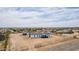 Expansive property featuring a single-story home, detached garage, and ample yard space with fencing at 30433 W Bellview St, Buckeye, AZ 85396