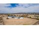 High angle picture showing a home in a desert neighborhood with large lots and detached garages at 30433 W Bellview St, Buckeye, AZ 85396