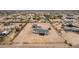 Well-spaced homes with the featured property having a garage and plenty of room for activities at 30433 W Bellview St, Buckeye, AZ 85396