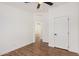 A large bedroom with wood floors, a ceiling fan, and two closets at 30433 W Bellview St, Buckeye, AZ 85396