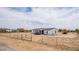 Well-maintained single-story home with large lot, fenced yard and welcoming front porch at 30433 W Bellview St, Buckeye, AZ 85396