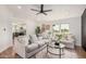 Bright living room showcasing stylish sofas, modern decor, and an inviting atmosphere at 30433 W Bellview St, Buckeye, AZ 85396