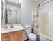 This bathroom features a shower/tub combo and single sink vanity with tile flooring at 30458 N Sunray Dr, San Tan Valley, AZ 85143