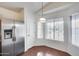 Eat-in kitchen featuring stainless steel appliances, tile flooring, and ample natural light at 30458 N Sunray Dr, San Tan Valley, AZ 85143