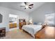 Inviting main bedroom with neutral carpet and an en-suite bathroom at 30458 N Sunray Dr, San Tan Valley, AZ 85143
