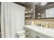 Modern bathroom with a shower, a large mirror, a white vanity, stylish decor, and a toilet at 3246 E Palm Ln, Phoenix, AZ 85008