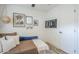 Cozy bedroom with a daybed, a ceiling fan, artwork, hardwood floors, and a TV at 3246 E Palm Ln, Phoenix, AZ 85008