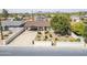 Charming single-story house featuring xeriscaping in the front yard, car port, and a vibrant red front door at 3246 E Palm Ln, Phoenix, AZ 85008