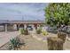 Well-maintained front yard featuring lush landscaping, a brick facade, and a welcoming entrance at 3246 E Palm Ln, Phoenix, AZ 85008