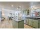 Open concept kitchen featuring stylish cabinetry, modern appliances, and an expansive island at 3246 E Palm Ln, Phoenix, AZ 85008