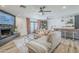 Inviting living room with neutral sectional, fireplace, decorative curtains, and a stylish wet bar at 3246 E Palm Ln, Phoenix, AZ 85008