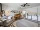 Comfortable living room features stylish decor, a piano, and abundant natural light at 3246 E Palm Ln, Phoenix, AZ 85008