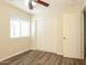 Bedroom with wood floors, ceiling fan and sliding closet door at 3323 W Fraktur Rd, Phoenix, AZ 85041