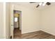 Bedroom with wood flooring and doorway to bathroom at 3323 W Fraktur Rd, Phoenix, AZ 85041