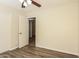 Bedroom with wood floors and door to the hallway at 3323 W Fraktur Rd, Phoenix, AZ 85041