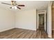 Light filled bedroom with laminate flooring, ceiling fan and neutral paint at 3323 W Fraktur Rd, Phoenix, AZ 85041