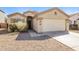 Charming single-story home with a well-kept front yard and a two-car garage at 3323 W Fraktur Rd, Phoenix, AZ 85041