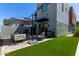 Modern backyard features patio seating, fire pit, grill, and artificial grass at 340 E Osborn Rd # 3, Phoenix, AZ 85012