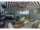 Stylish backyard with outdoor seating around a fire pit and lush green lawn at 340 E Osborn Rd # 3, Phoenix, AZ 85012