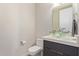 Sleek powder room features a vessel sink, quartz countertop, modern fixtures, and efficient design at 340 E Osborn Rd # 3, Phoenix, AZ 85012