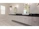 Bathroom with dual sinks and vanity featuring modern fixtures and ample counter space at 340 E Osborn Rd # 3, Phoenix, AZ 85012