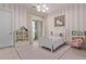 bedroom features a white bed, toy shelves, and a sliding glass door at 340 E Osborn Rd # 3, Phoenix, AZ 85012