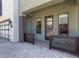 Inviting front porch with decorative metal screens and a glass-paneled front door at 340 E Osborn Rd # 3, Phoenix, AZ 85012