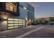 Modern two-story home featuring a frosted glass garage door, clean lines and unique architectural details at 340 E Osborn Rd # 3, Phoenix, AZ 85012