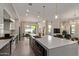 Bright, modern kitchen features a large island, stainless steel appliances, and an open layout at 340 E Osborn Rd # 3, Phoenix, AZ 85012