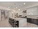 Modern kitchen with a large island and seating, stainless steel appliances, and sleek cabinetry at 340 E Osborn Rd # 3, Phoenix, AZ 85012
