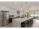 Modern kitchen with stainless steel appliances, quartz countertops, and pendant lighting at 340 E Osborn Rd # 3, Phoenix, AZ 85012