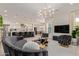 Bright, open-concept living room and kitchen with modern lighting and stylish furniture at 340 E Osborn Rd # 3, Phoenix, AZ 85012
