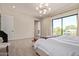 Spacious main bedroom with a large window, modern lighting, and ample space for relaxation at 340 E Osborn Rd # 3, Phoenix, AZ 85012