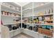 Organized walk-in pantry with ample shelving for food storage and small appliances, maximizing kitchen efficiency at 340 E Osborn Rd # 3, Phoenix, AZ 85012