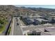 Neighborhood aerial view showcasing multiple homes nestled in a community surrounded by mountains and green spaces at 3429 E Constance Way, Phoenix, AZ 85042