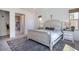Inviting bedroom features a comfortable bed, neutral decor, and two large windows with natural light at 3429 E Constance Way, Phoenix, AZ 85042