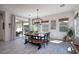 Bright dining area with a rustic table and ample natural light at 3429 E Constance Way, Phoenix, AZ 85042