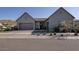 Attractive exterior view of home with three-car garage, desert landscaping, and covered entry at 3429 E Constance Way, Phoenix, AZ 85042