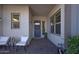 Charming front porch with stylish seating and decorative wreath on front door at 3429 E Constance Way, Phoenix, AZ 85042