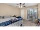 Bedroom with ceiling fan, balcony access, and comfortable carpeting at 3633 N 3Rd Ave # 2012, Phoenix, AZ 85013