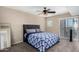 Bedroom with ceiling fan, balcony access, and a comfortable carpeted floor at 3633 N 3Rd Ave # 2012, Phoenix, AZ 85013