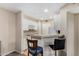 Bright kitchen with white cabinets, a breakfast bar, and modern appliances at 3633 N 3Rd Ave # 2012, Phoenix, AZ 85013