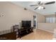 Living room with laminated floors, fan and television set at 3633 N 3Rd Ave # 2012, Phoenix, AZ 85013