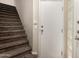 Staircase featuring plush carpet and a door leading outside to the property at 3633 N 3Rd Ave # 2012, Phoenix, AZ 85013