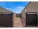 Fully enclosed backyard featuring gravel and a patch of artificial grass at 3818 N 306Th Ave, Buckeye, AZ 85396