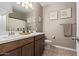 Well-lit bathroom features a dual sink vanity, framed art, and coordinated towels at 3818 N 306Th Ave, Buckeye, AZ 85396