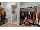 Well-organized closet with an attached laundry room featuring modern appliances and ample storage solutions at 3818 N 306Th Ave, Buckeye, AZ 85396